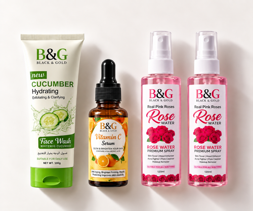 Four B&G Black & Gold skincare products arranged side by side on a white background: a green and white Cucumber Face Wash tube, an amber Vitamin C Serum dropper bottle, and two pink Rose Water spray bottles.